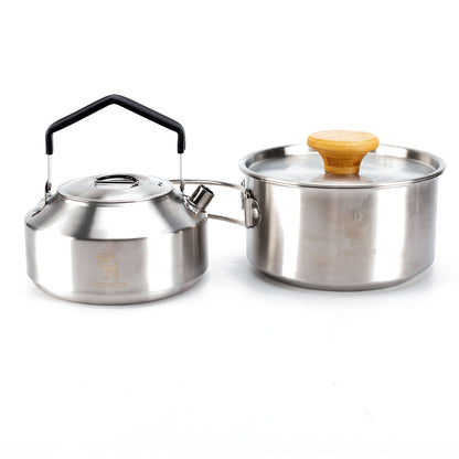 Stainless steel kettle and pot set on a white background