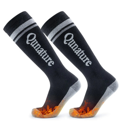 Black socks with 'Qunature' branding and flame-patterned toes on a white background