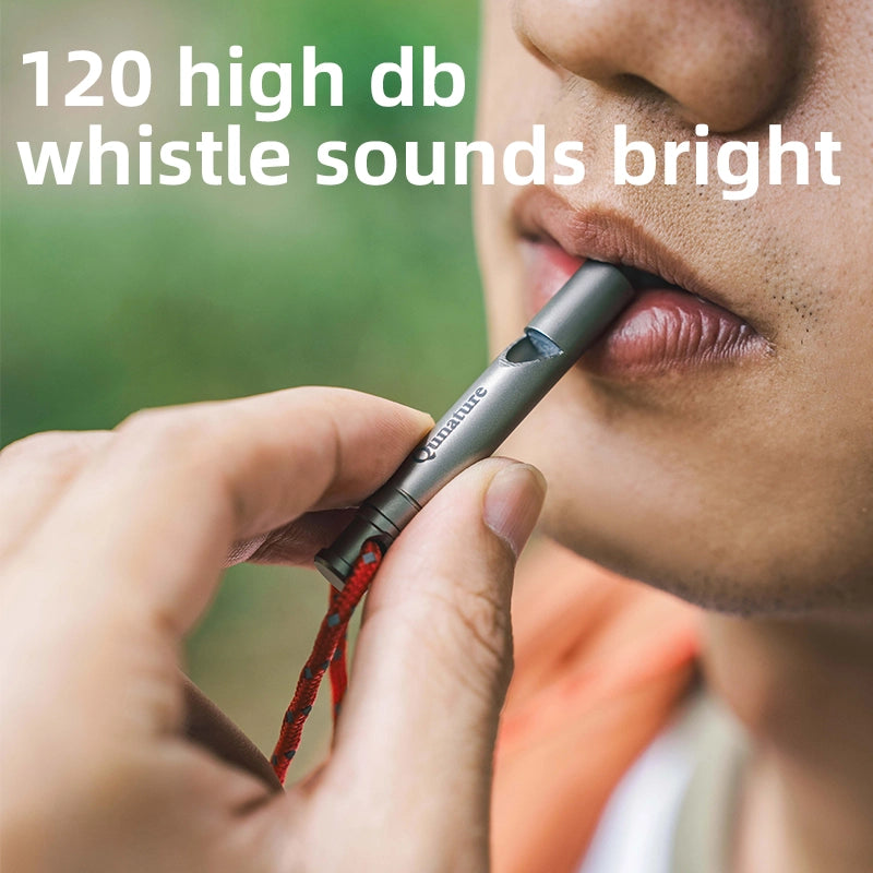 Person holding a whistle with text indicating high decibel level