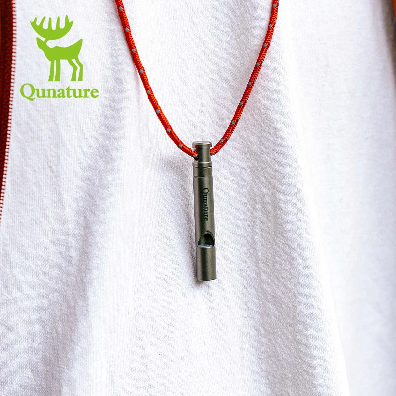 Metal whistle on a red rope with Qunature logo on a white background