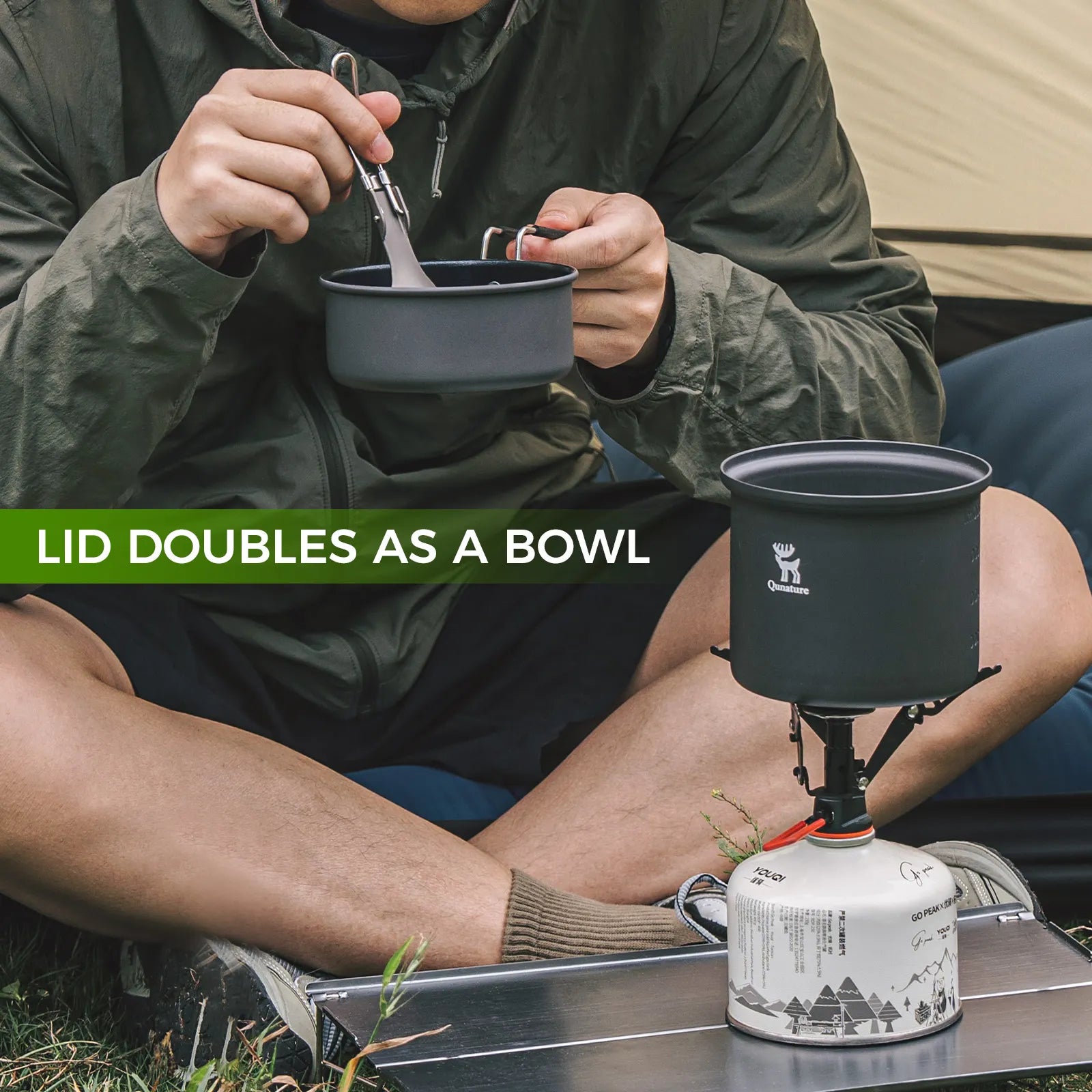 Person camping with a portable stove and pot, highlighting the lid's functionality.