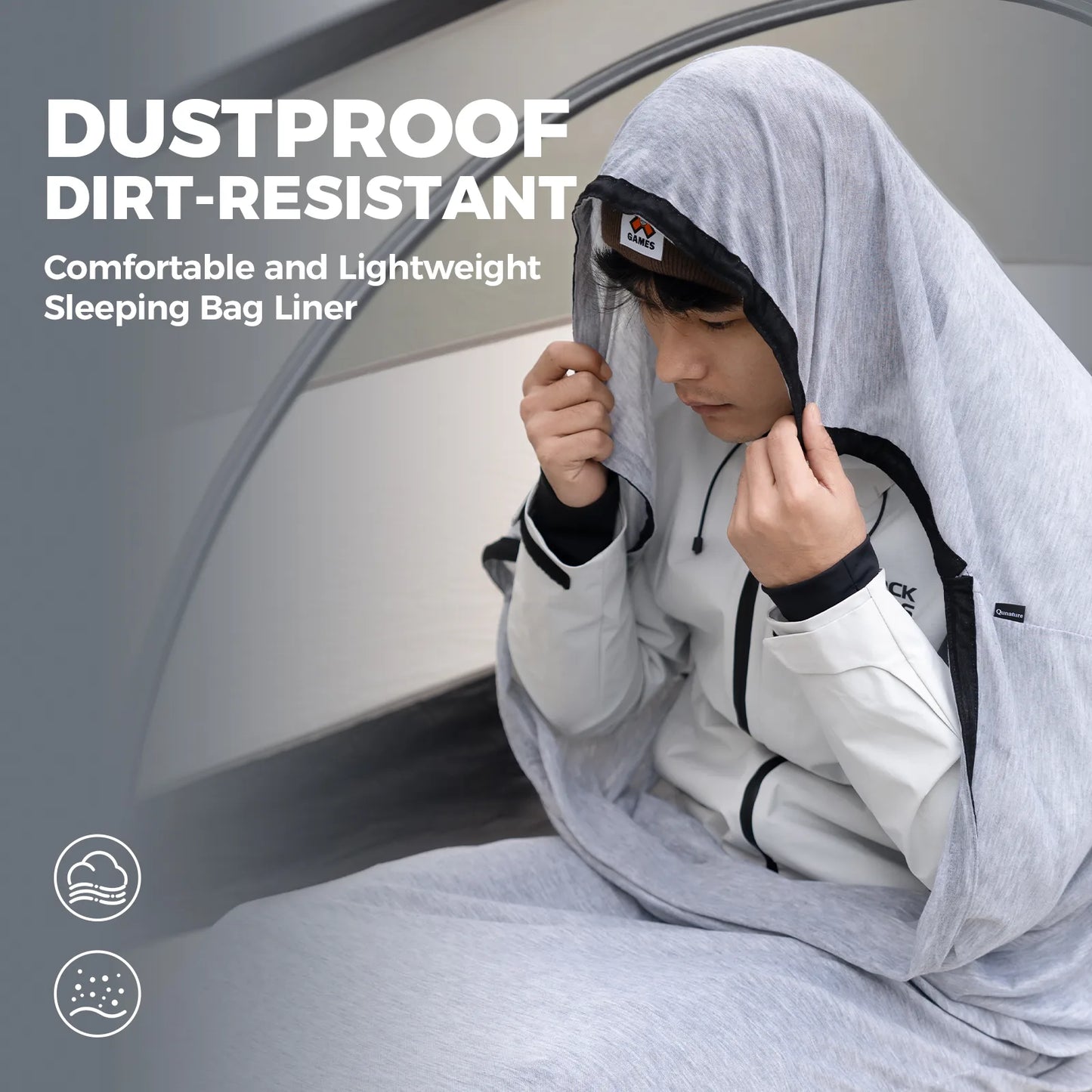 Person using a dustproof and dirt-resistant sleeping bag liner inside a tent.