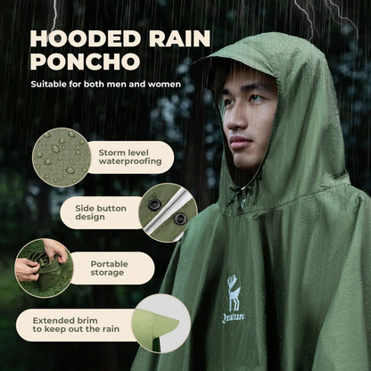 Person wearing a green hooded rain poncho with features highlighted on a dark background