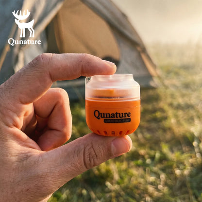Hand holding a Qunature product with a camping background