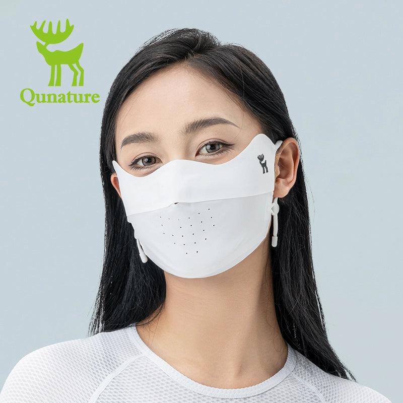 Woman wearing a face mask with Qunature branding on a gray background