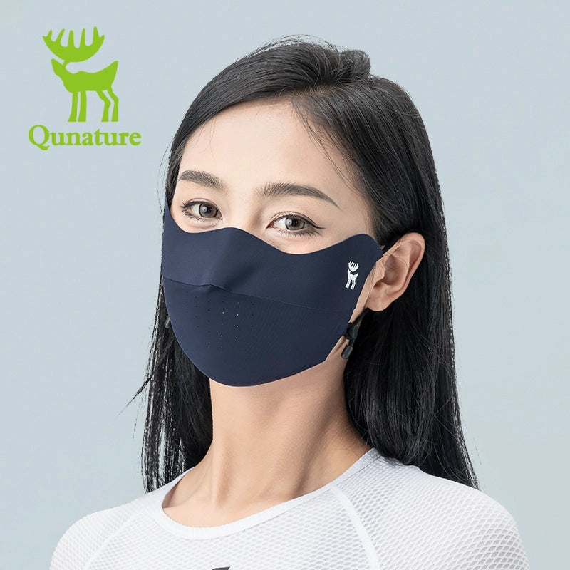 Woman wearing a face mask with Qunature branding on a gray background