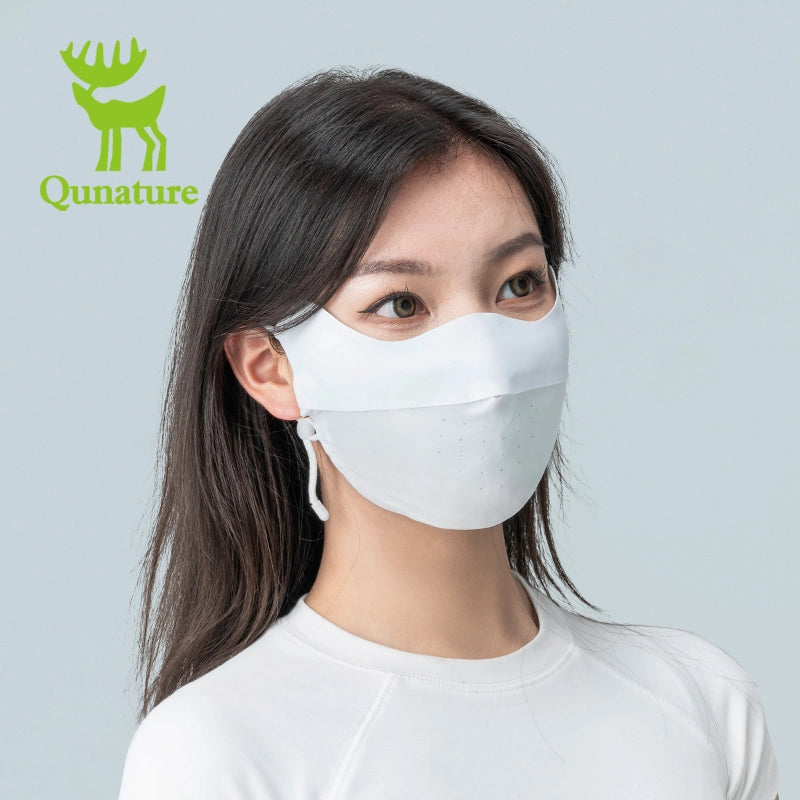Woman wearing a face mask with Qunature branding on a gray background