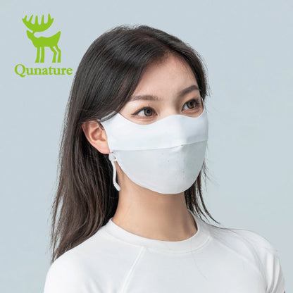 Woman wearing a face mask with Qunature branding on a gray background