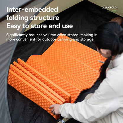 Orange inter-embedded folding structure being used inside a tent with text highlighting its convenience for outdoor carrying and storage.