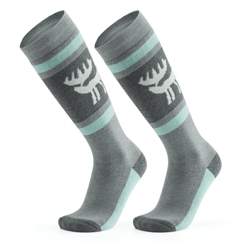 A pair of gray wool ski socks with a striped design and a reindeer logo on the ankle.
