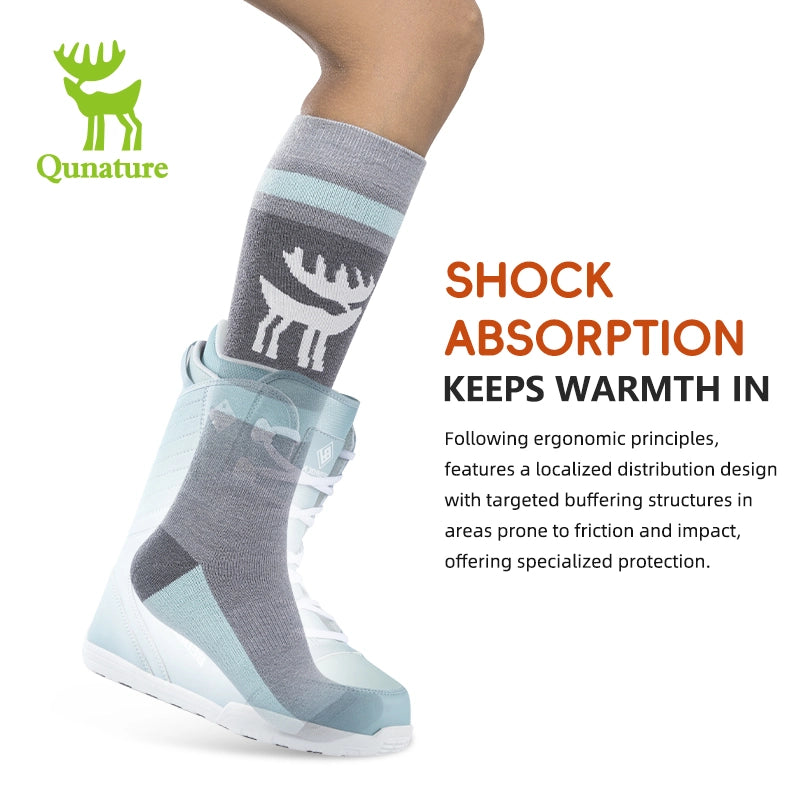 Gray and light blue sock with deer design worn by a person, on a white background with Qunature branding.