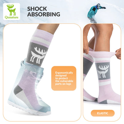 Colorful socks with a deer design worn by a person, featuring text about shock absorption and elasticity.